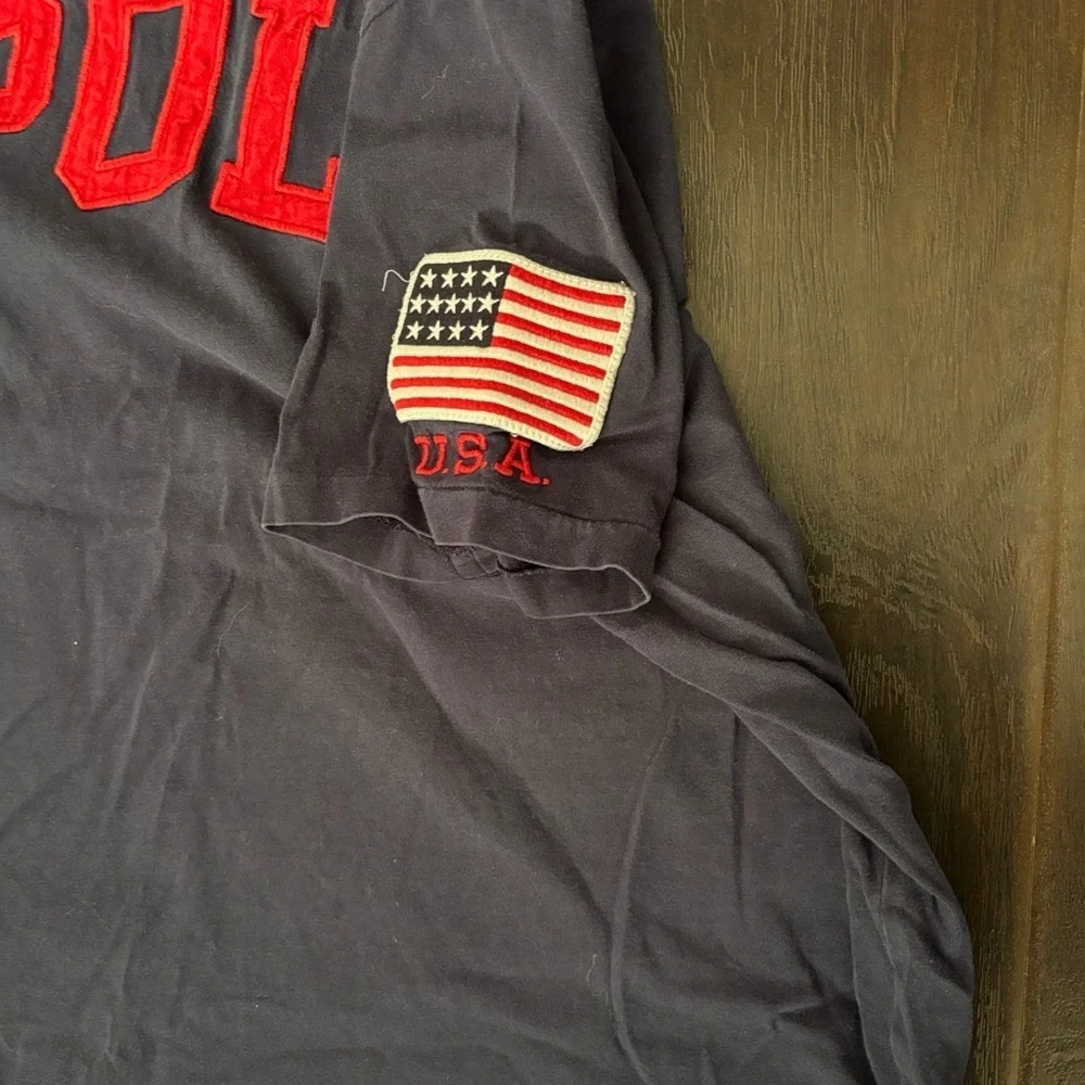🇺🇸 Classic POLO Tee – Bold Logo + USA Flag Sleeve | 90’s Cool Staple